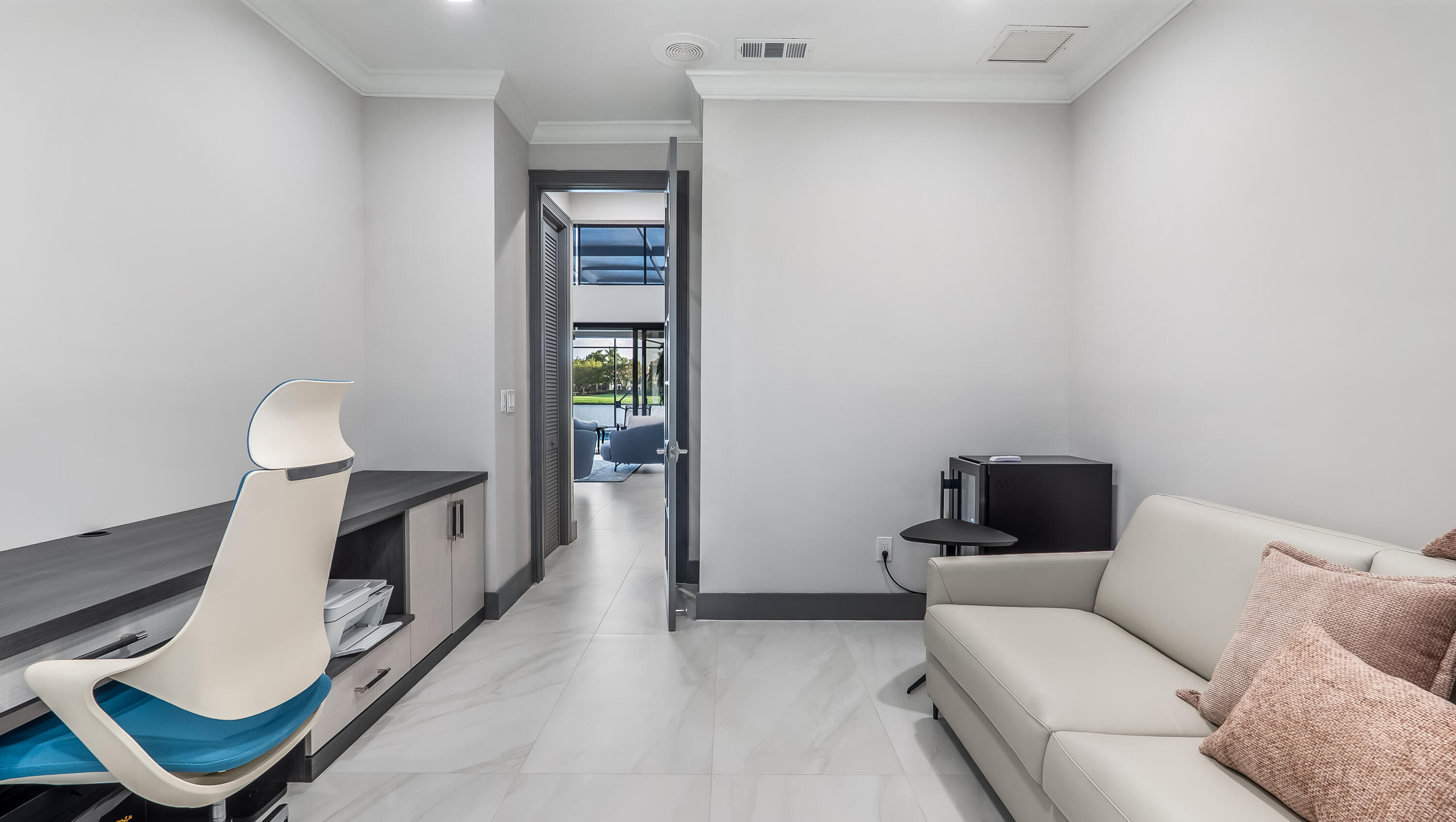 17683 Sealakes Drive Boca Raton, FL 33498 - Photo 43 of 61 a living room with furniture and a lamp