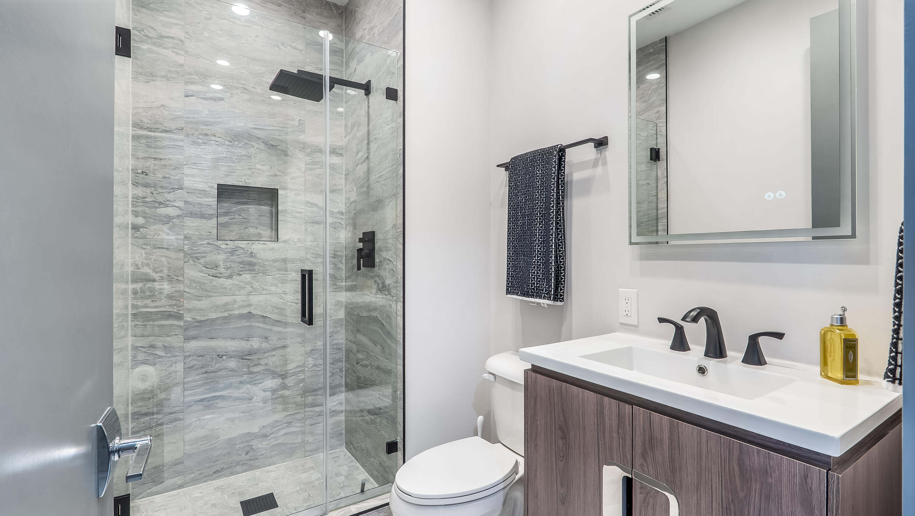 17683 Sealakes Drive Boca Raton, FL 33498 - Photo 45 of 61 a bathroom with a sink toilet and shower