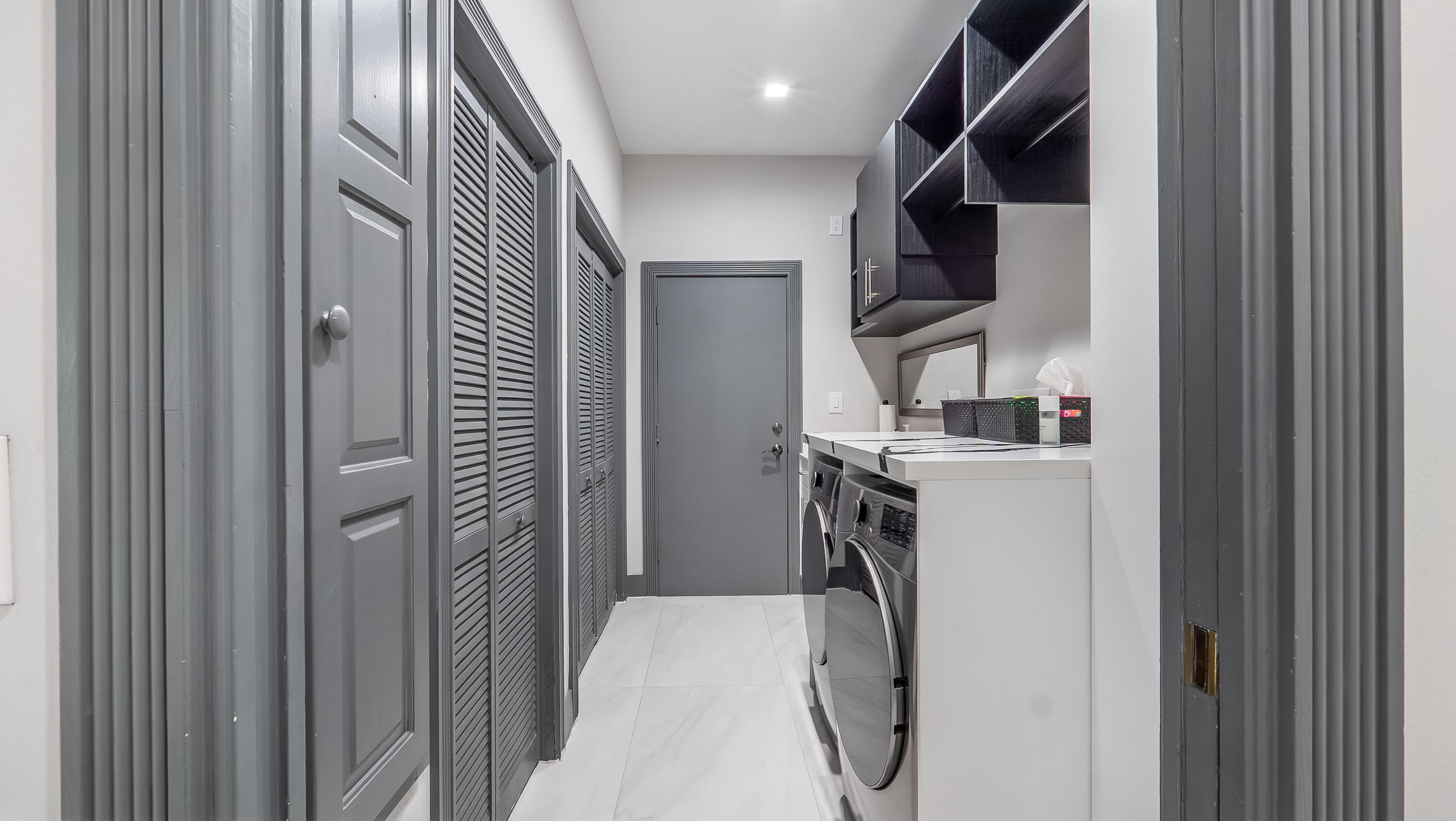 17683 Sealakes Drive Boca Raton, FL 33498 - Photo 46 of 61 a utility room with dryer and washer