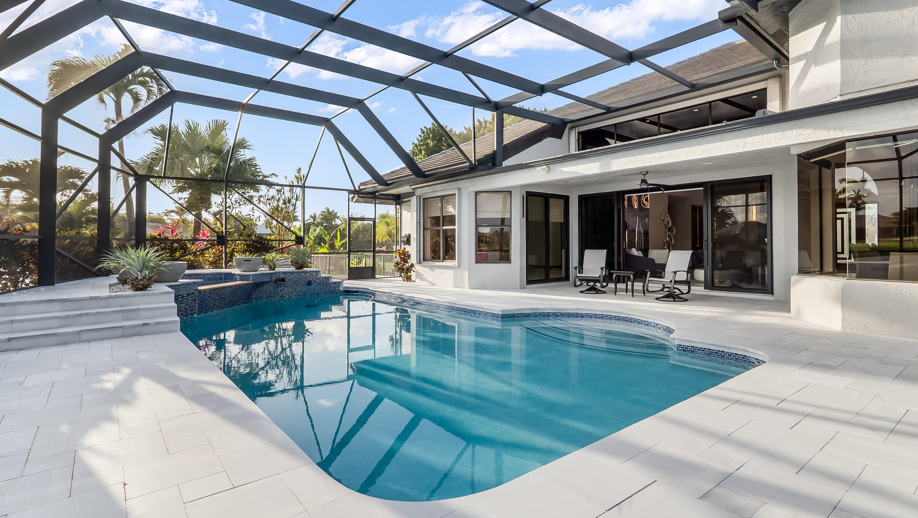 17683 Sealakes Drive Boca Raton, FL 33498 - Photo 57 of 61 a view of a swimming pool with outdoor seating