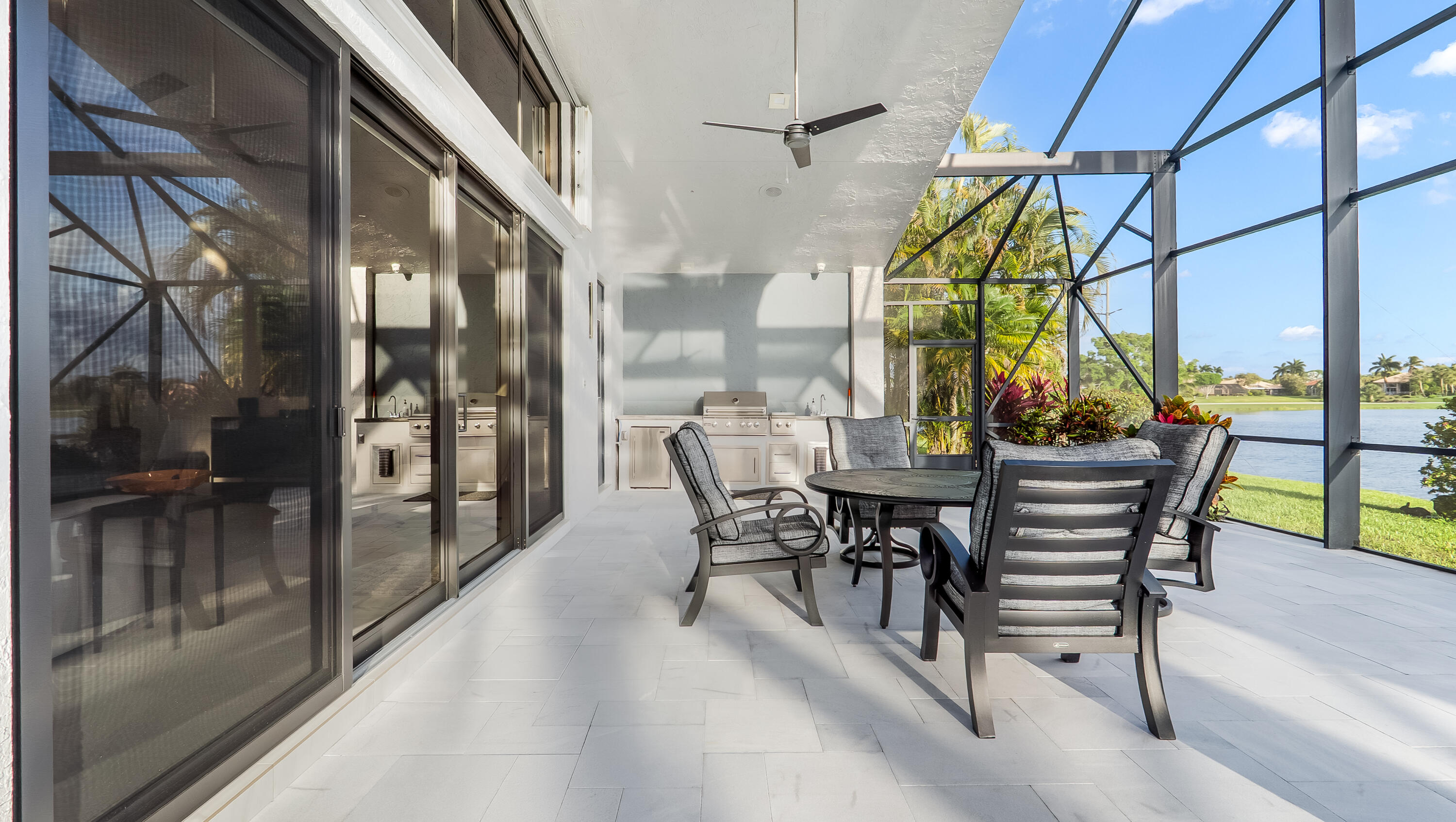 17683 Sealakes Drive Boca Raton, FL 33498 - Photo 59 of 61 a view of a patio with a table and chairs