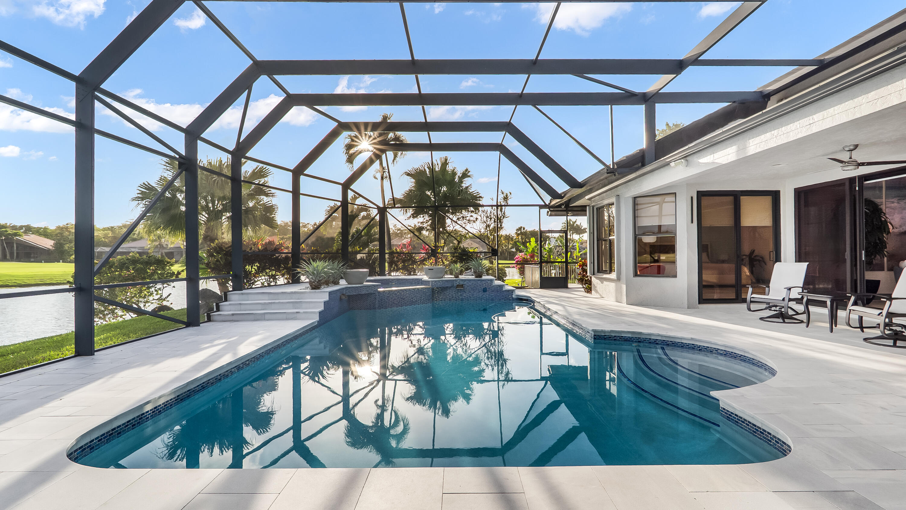 17683 Sealakes Drive Boca Raton, FL 33498 - Photo 60 of 61 a view of a swimming pool with outdoor seating