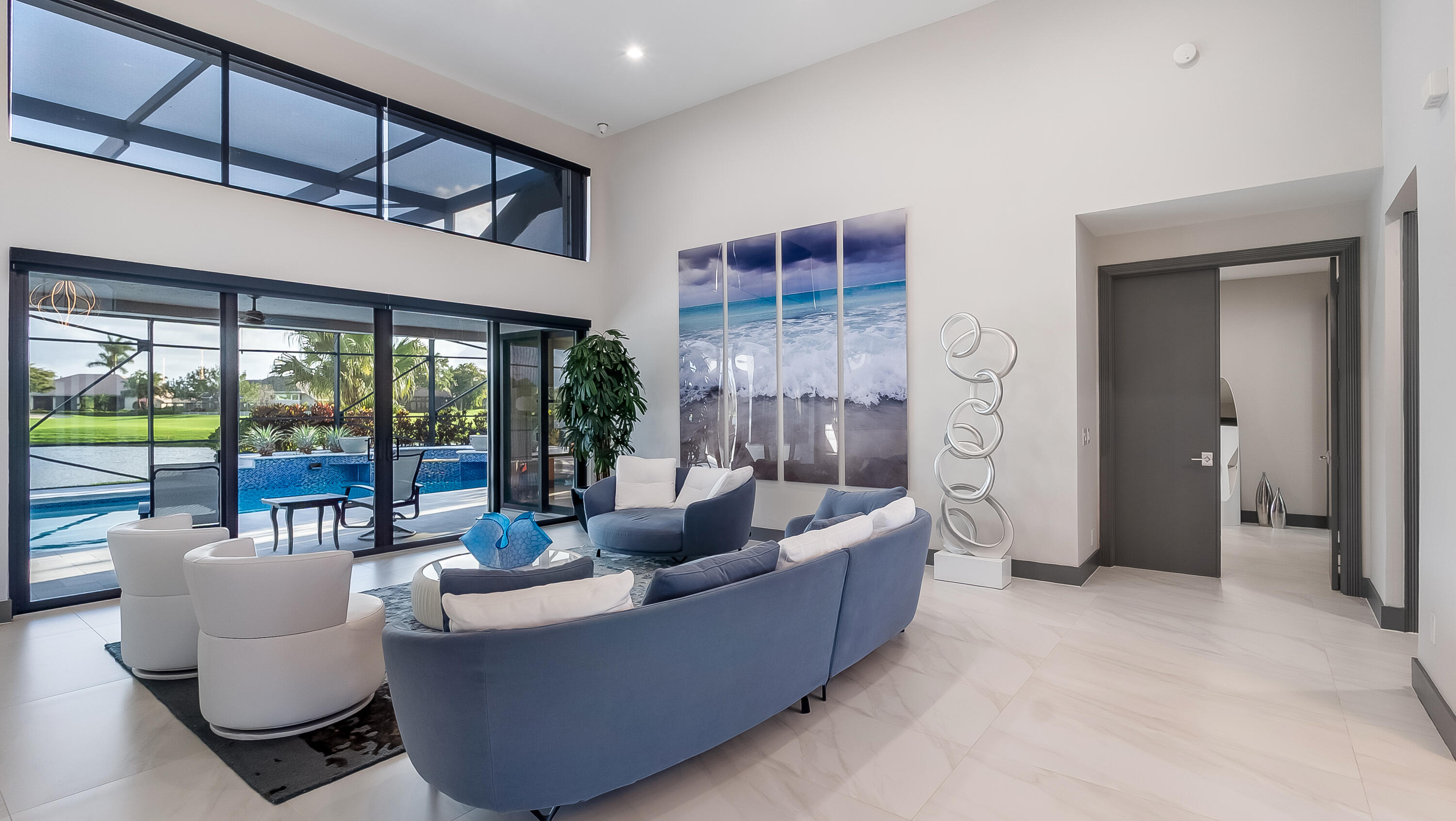17683 Sealakes Drive Boca Raton, FL 33498 - Photo 9 of 61 a living room with couches and a large window