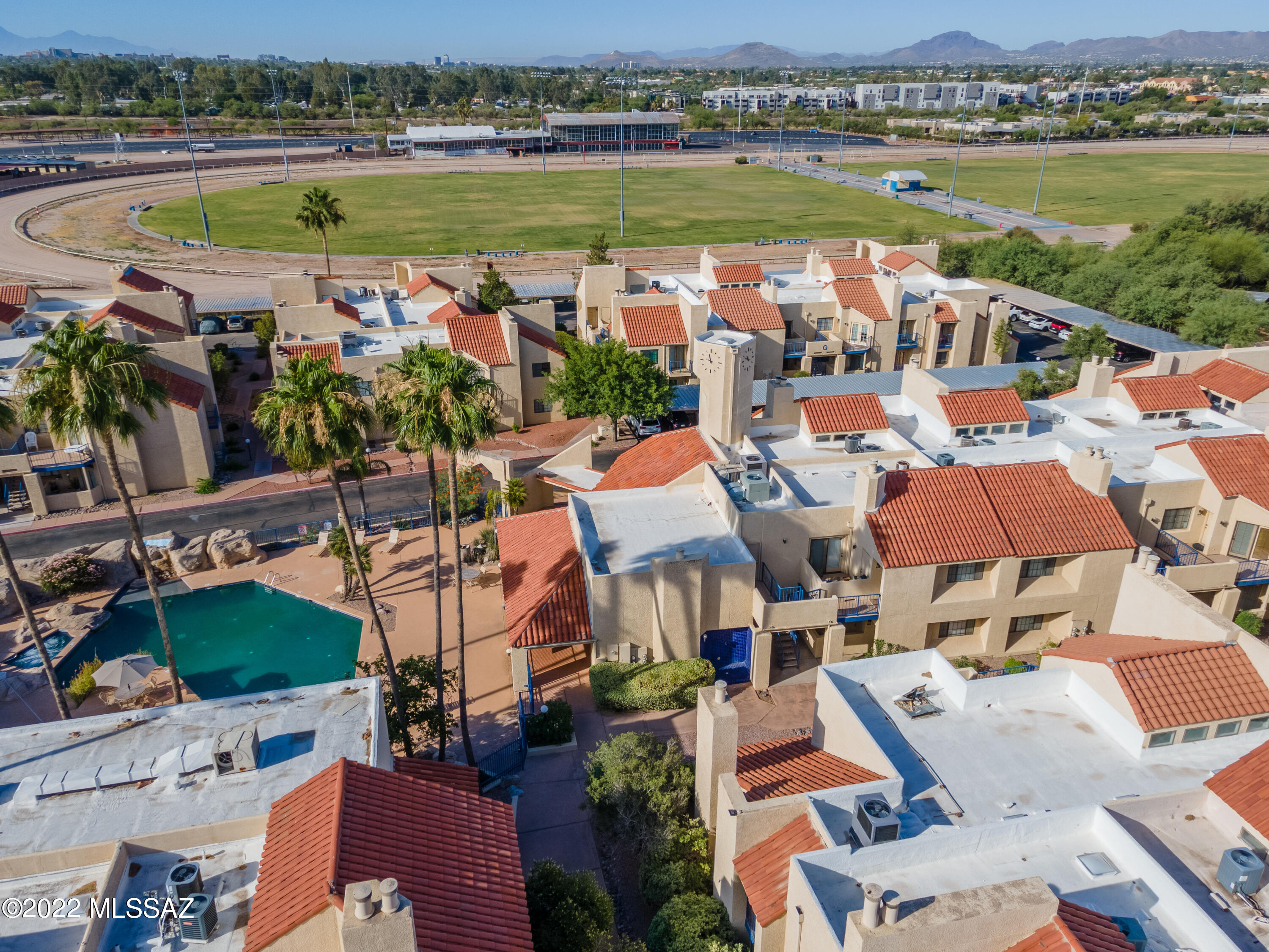1200 East River Road, Unit F69 Tucson, AZ 85718 - Photo 18 of 22 an aerial view of a city with lawn chairs