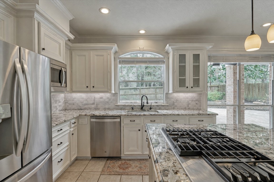 91 Wind Ridge Circle The Woodlands, TX 77381 - Photo 10 of 50 Beautiful sightlines to a private retreat in back with enviable natural light!