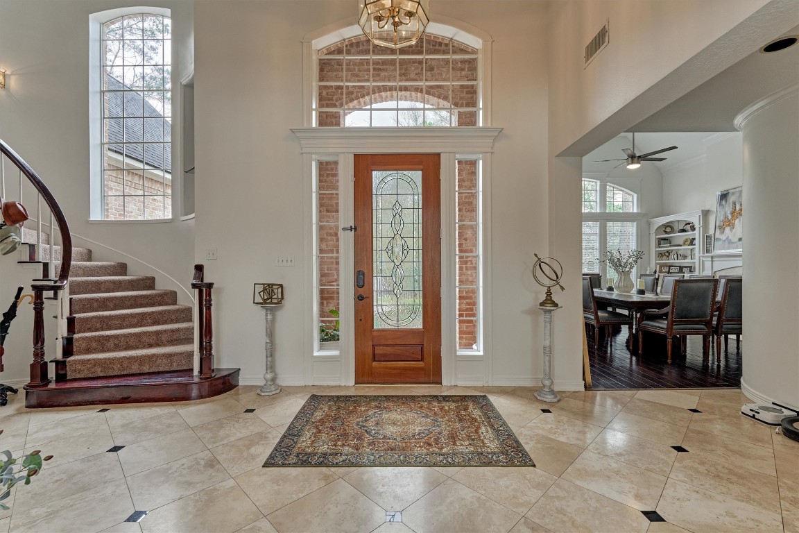 91 Wind Ridge Circle The Woodlands, TX 77381 - Photo 17 of 50 Southern elegance blends with modern comforts throughout this well-loved home. Hallway to right leads to a home office and the owner's secluded suite.