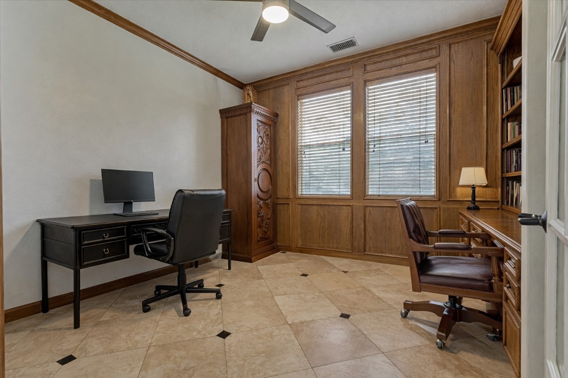 91 Wind Ridge Circle The Woodlands, TX 77381 - Photo 18 of 50 Sequestered home office with handsome wood paneling and tile flooring.