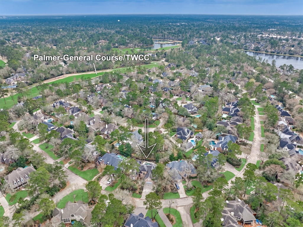 91 Wind Ridge Circle The Woodlands, TX 77381 - Photo 2 of 50 Nestled in a golf course neighborhood with captivating drive-home views of The Palmer General course - one of three 9-hole tracks affiliated with The Woodlands Country Club!