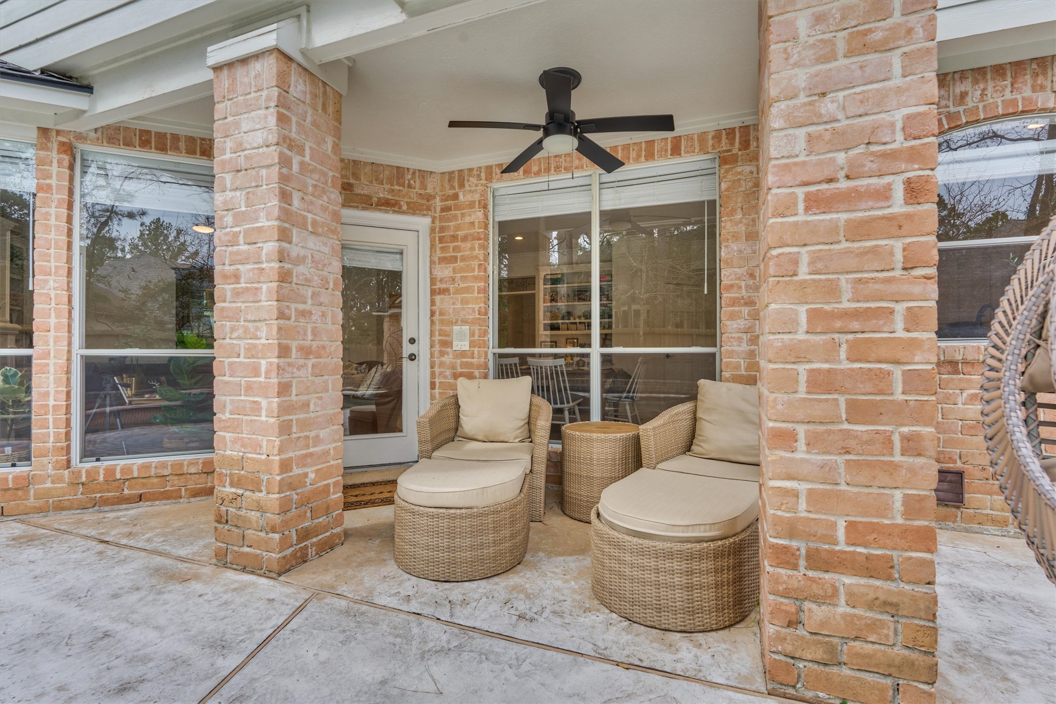 91 Wind Ridge Circle Spring, TX 77381 - Photo 37 of 50 Relax in the shade under the covered patio with ceiling fan.