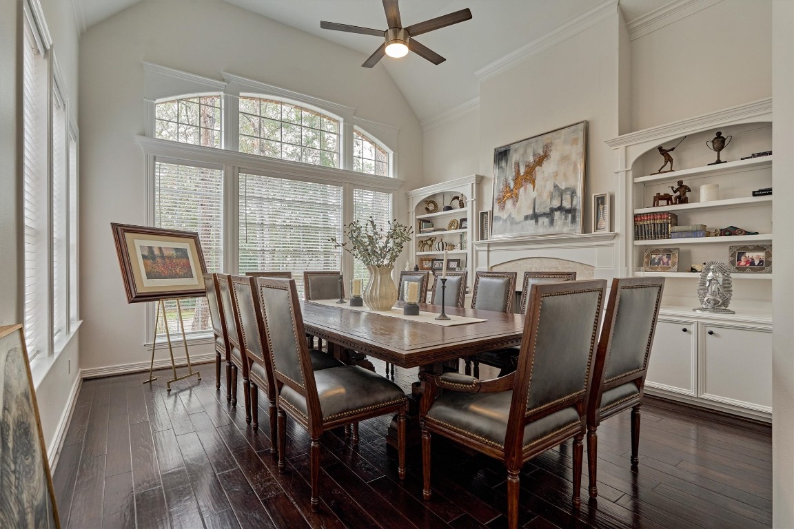 91 Wind Ridge Circle The Woodlands, TX 77381 - Photo 6 of 50 This beautifully appointed living room, currently used as a dining room, flaunts tall ceilings, and a fireplace flanked with built-ins for ultimate ambience!