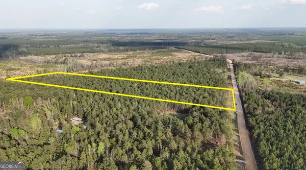 a view of a swimming pool and an outdoor space