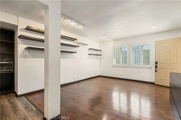 a view of an empty room with a window