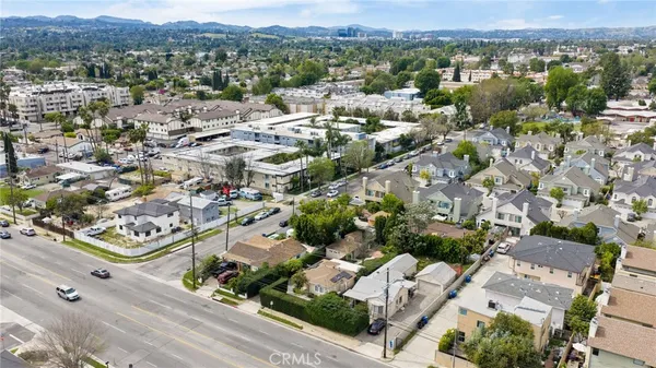 an aerial view of residential houses with outdoor space