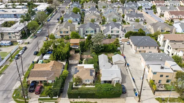 a view of multiple houses with yard