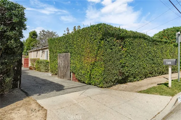 a view of a yard and front view of a house