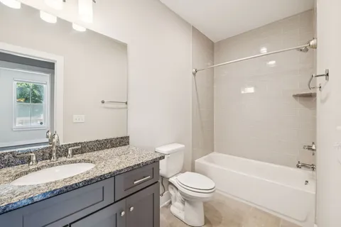 a view of hallway with wooden floor
