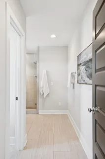 a bathroom with a granite countertop sink mirror and shower