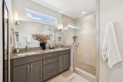 a view of hallway with wooden floor