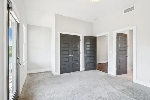 a view of a house with backyard porch and sitting area