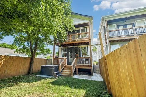 an aerial view of a house with a swimming pool