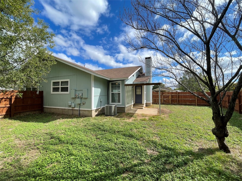 12810 Broughton Way, Unit A Austin, TX 78727 - Photo 13 of 16 a front view of a house with garden
