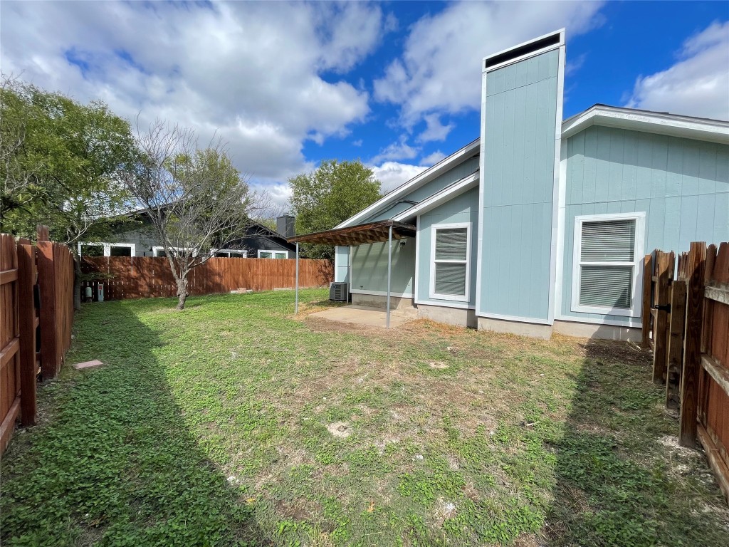 12810 Broughton Way, Unit A Austin, TX 78727 - Photo 14 of 16 a view of a house with backyard and porch