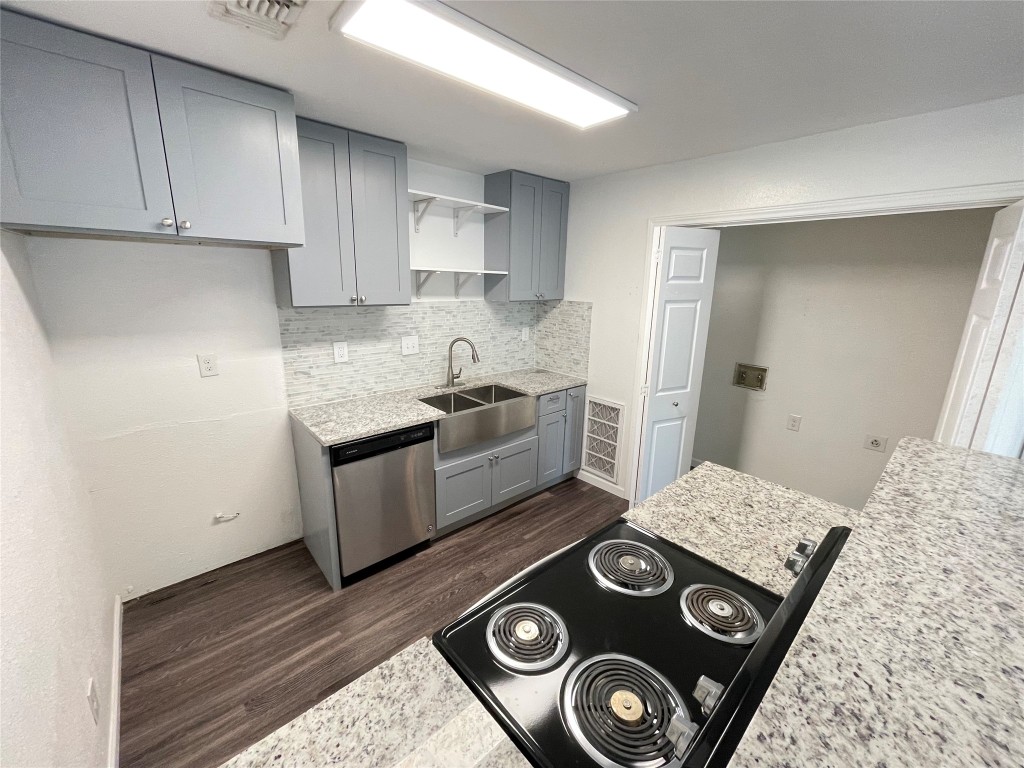 12810 Broughton Way, Unit A Austin, TX 78727 - Photo 6 of 16 a kitchen with a stove and a sink