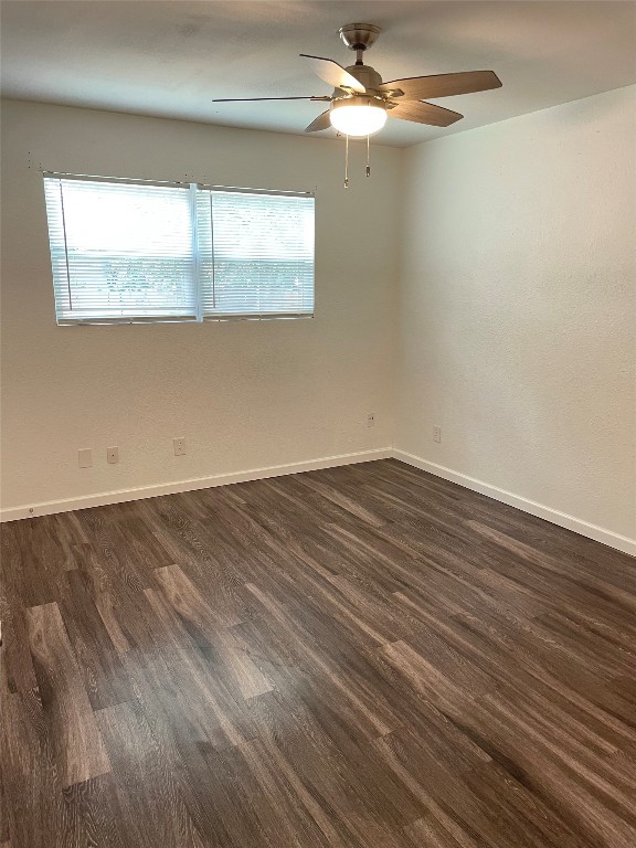 12810 Broughton Way, Unit A Austin, TX 78727 - Photo 7 of 16 an empty room with wooden floor and windows