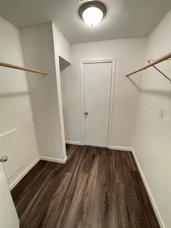 12810 Broughton Way, Unit A Austin, TX 78727 - Photo 8 of 16 an empty room with wooden floor and white walls