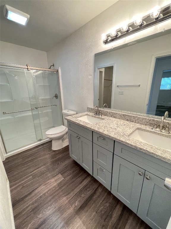 12810 Broughton Way, Unit A Austin, TX 78727 - Photo 10 of 16 a spacious bathroom with a granite countertop sink toilet and shower