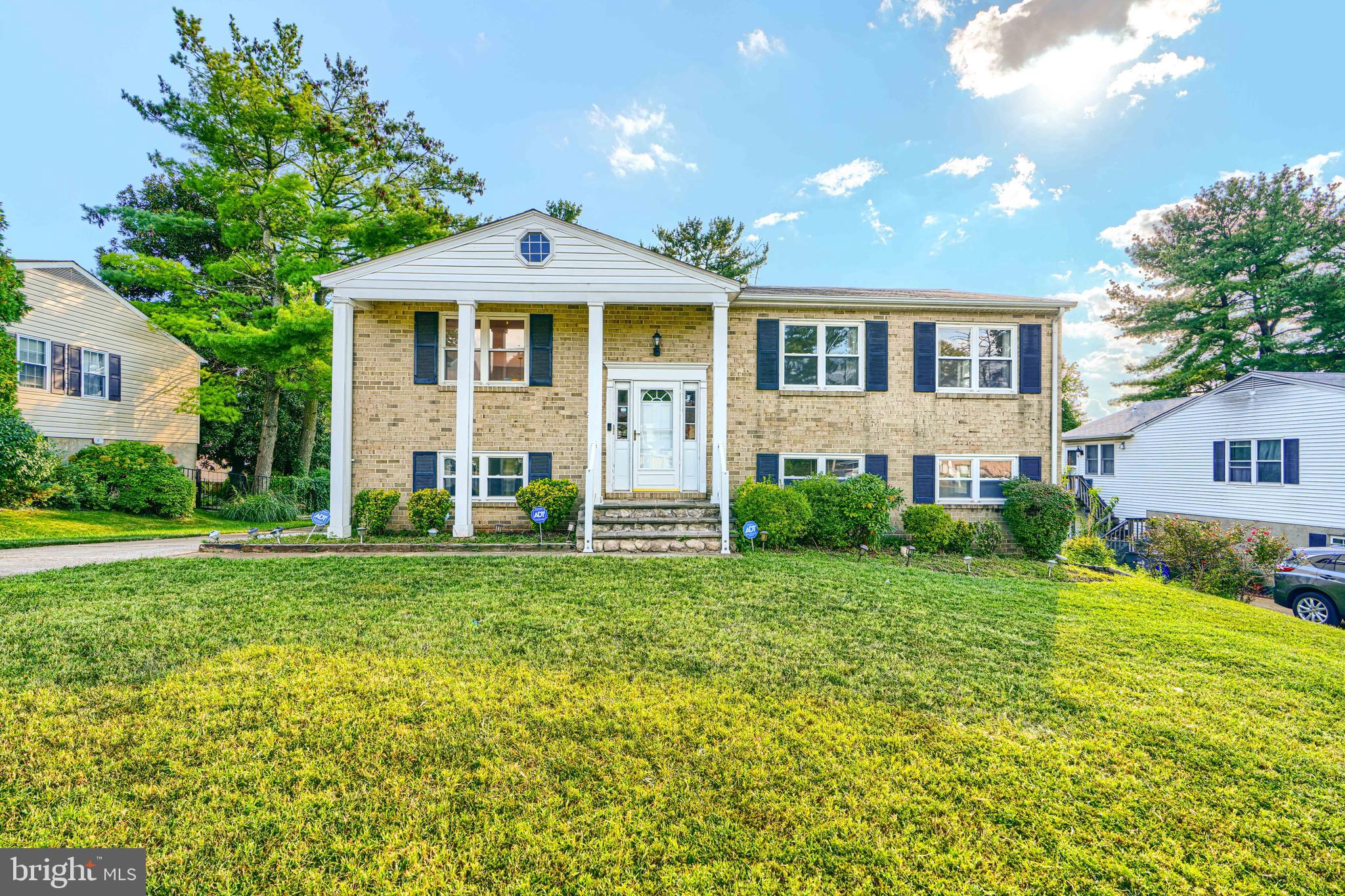 7209 Pinecrest Road Baltimore, MD 21228 - Photo 1 of 35 a front view of a house with a yard