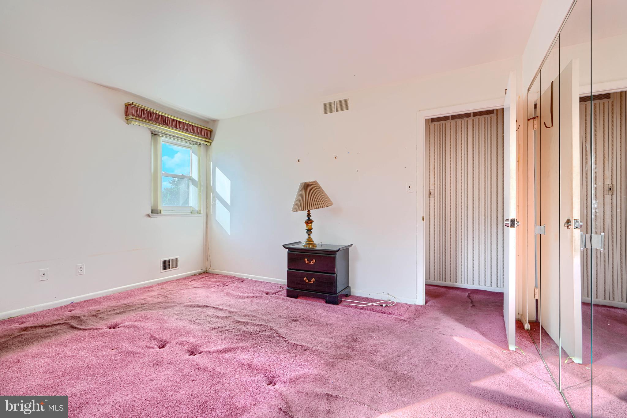 7209 Pinecrest Road Baltimore, MD 21228 - Photo 11 of 35 a bedroom with a bed and a window