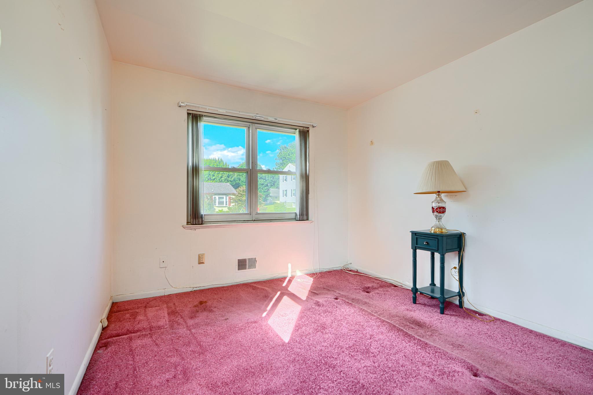 7209 Pinecrest Road Baltimore, MD 21228 - Photo 19 of 35 a bedroom with a bed and a window