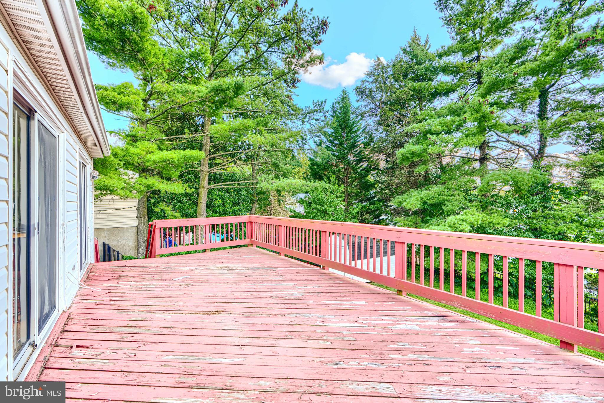 7209 Pinecrest Road Baltimore, MD 21228 - Photo 22 of 35 a view of balcony with wooden floor and fence