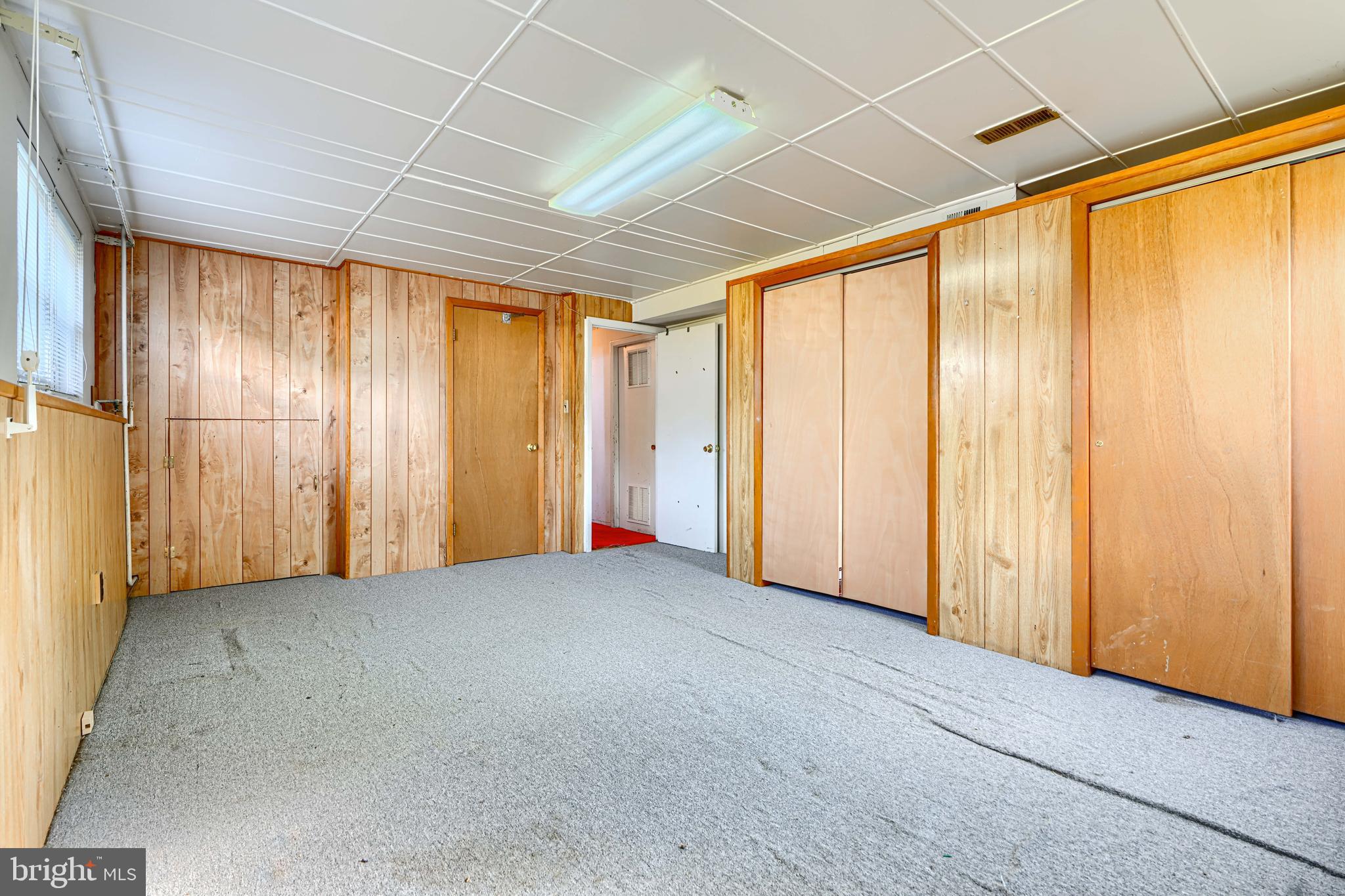 7209 Pinecrest Road Baltimore, MD 21228 - Photo 23 of 35 an empty room with windows