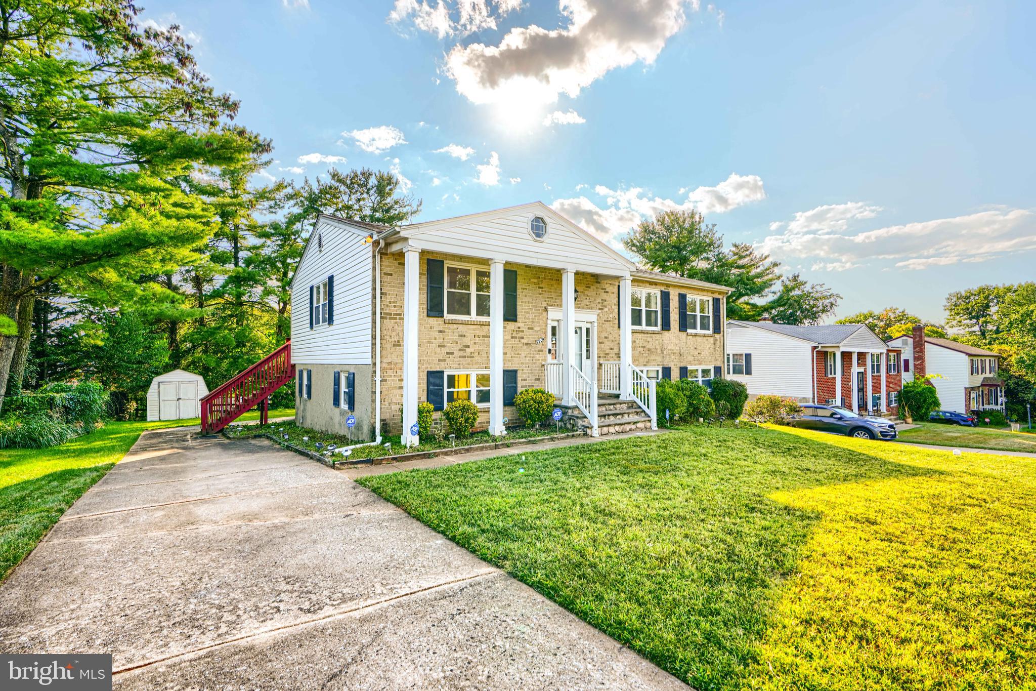 7209 Pinecrest Road Baltimore, MD 21228 - Photo 3 of 35 a front view of a house with a yard