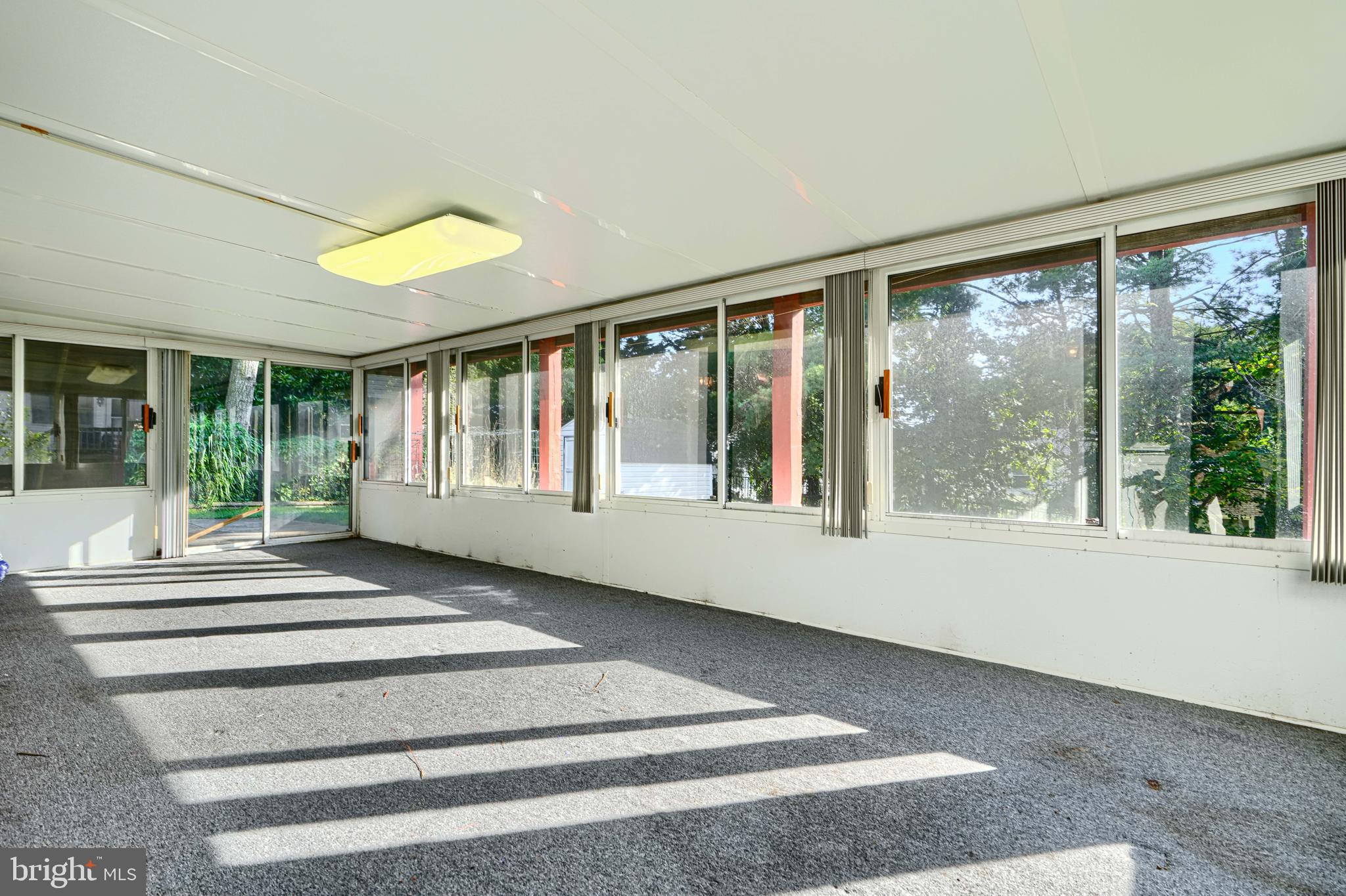 7209 Pinecrest Road Baltimore, MD 21228 - Photo 31 of 35 a view of an entrance with wooden floor and windows
