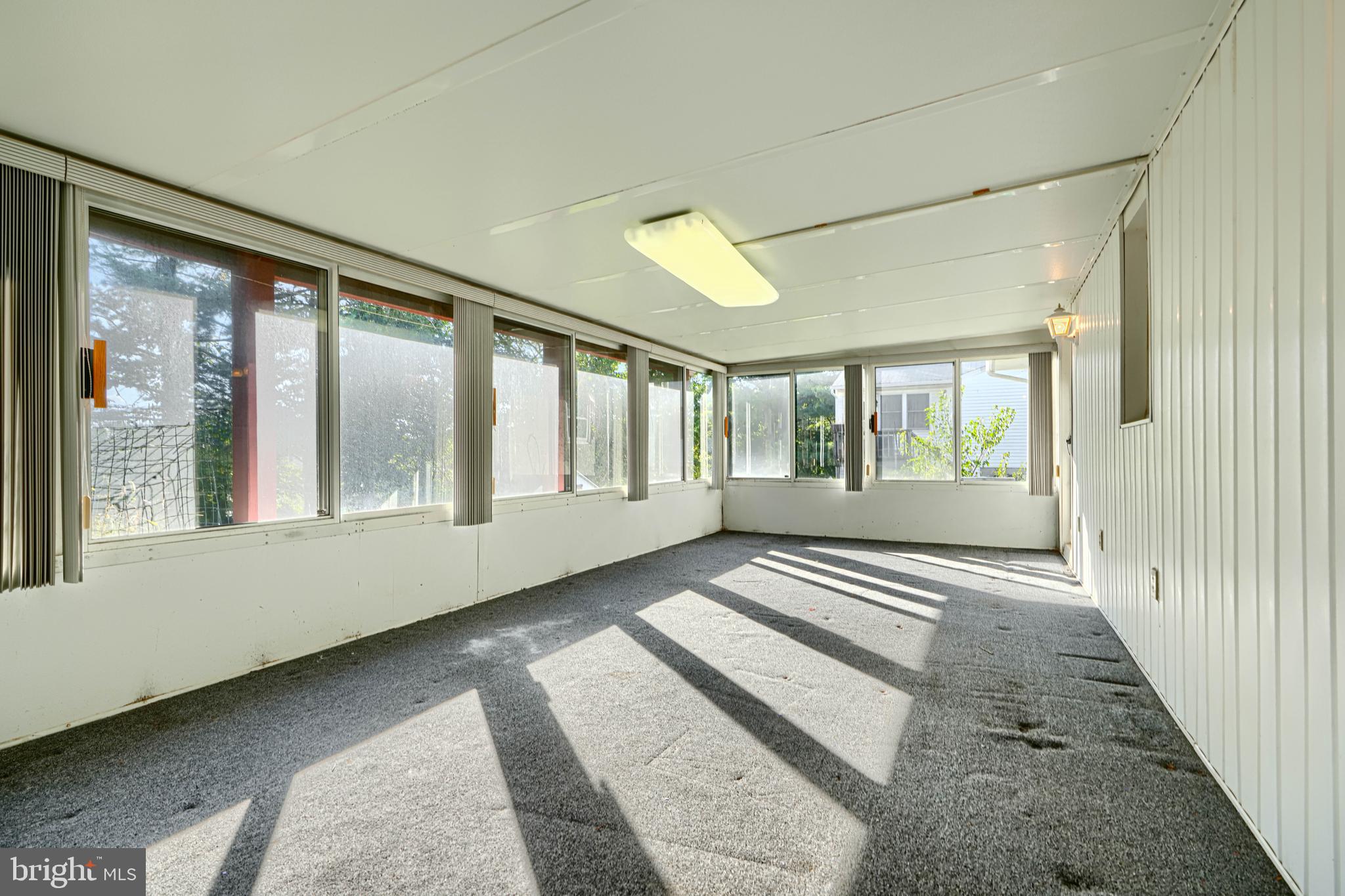 7209 Pinecrest Road Baltimore, MD 21228 - Photo 32 of 35 a view of an empty room with a window