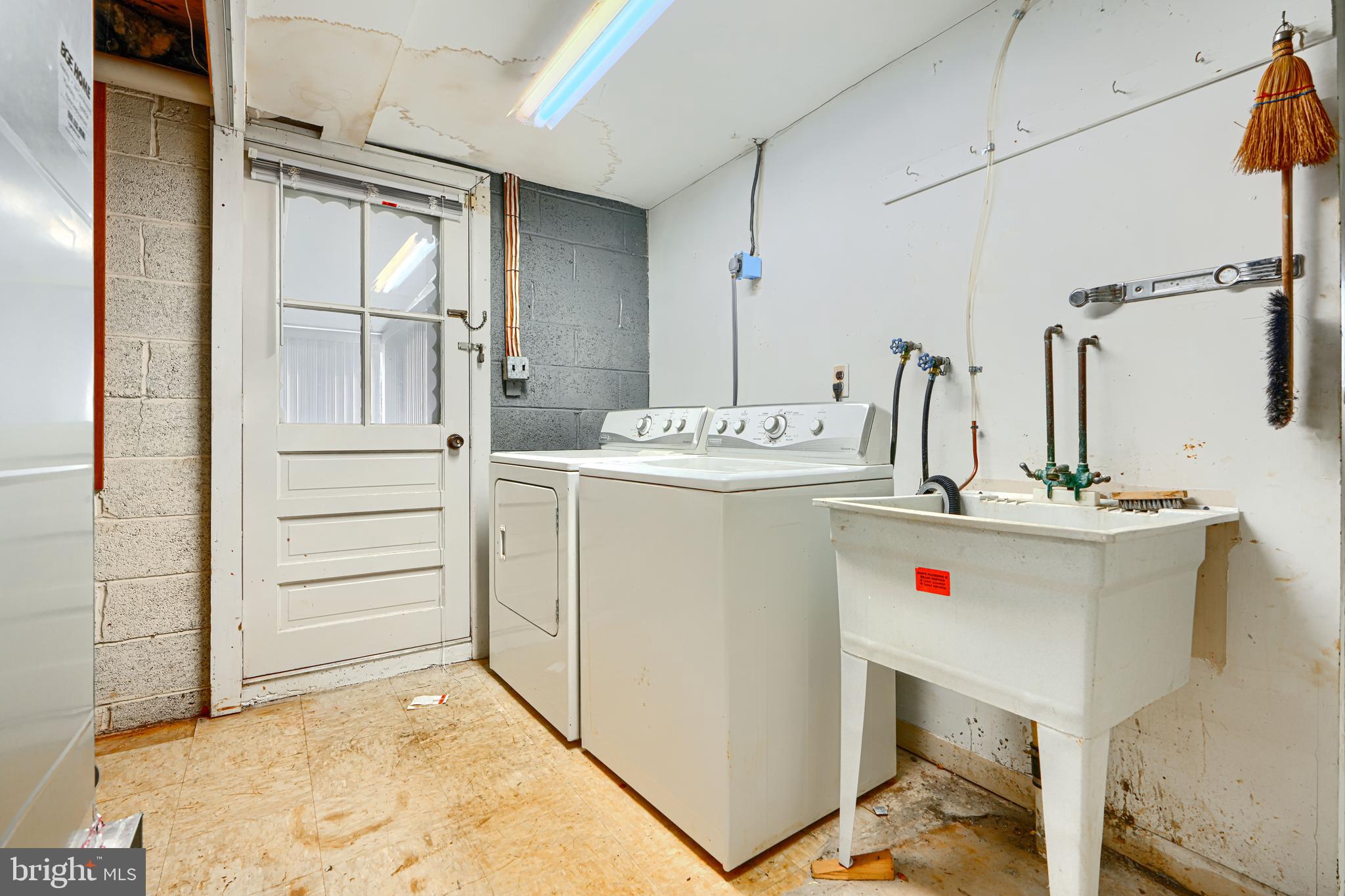 7209 Pinecrest Road Baltimore, MD 21228 - Photo 34 of 35 a utility room with closet dryer and washer