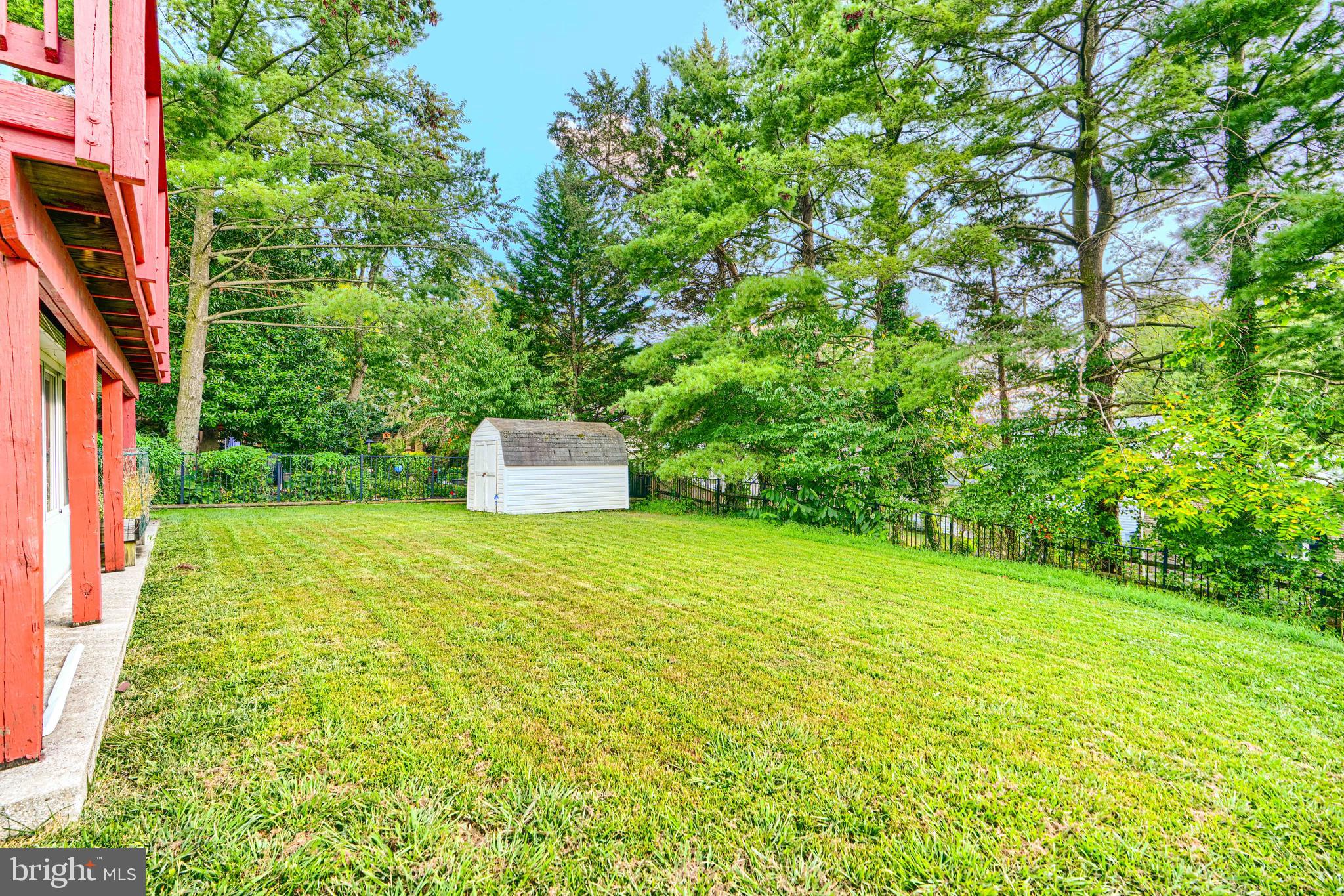 7209 Pinecrest Road Baltimore, MD 21228 - Photo 4 of 35 a backyard of a house with lots of green space and fountain