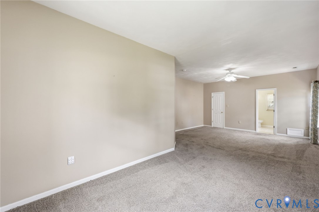 14719 Clover Ridge Lane Chesterfield, VA 23832 - Photo 21 of 36 Spacious carpeted room featuring a ceiling fan, ne