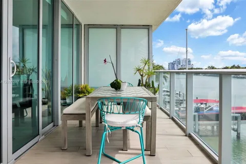 a living room with a table and chairs