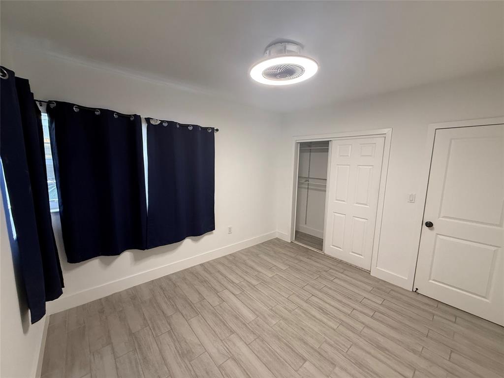 Undisclosed Address Miami, FL 33125 - Photo 7 of 9 a view of closet with wooden floor