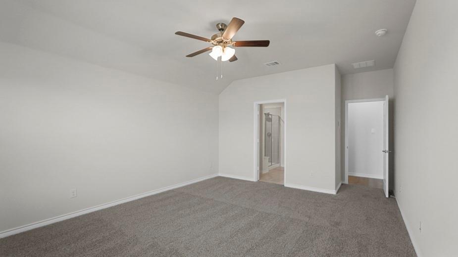 439 Epiphany Lane Lavon, TX 75166 - Photo 18 of 31 Spacious room featuring light gray walls, gray carpet flooring, and a ceiling fan with integrated lighting