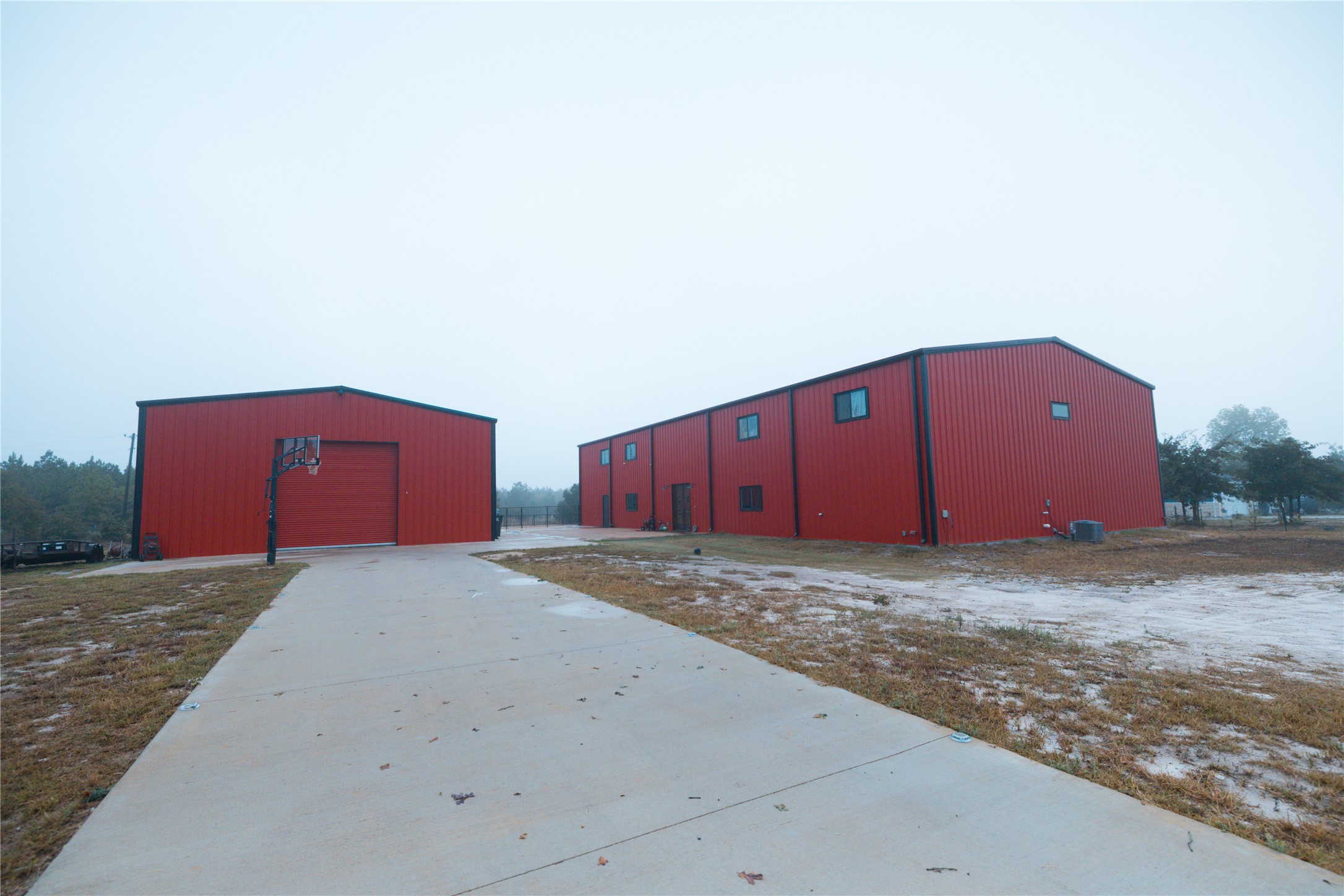 143 County Road Paige, TX 78659 - Photo 35 of 36 View of pole building featuring driveway