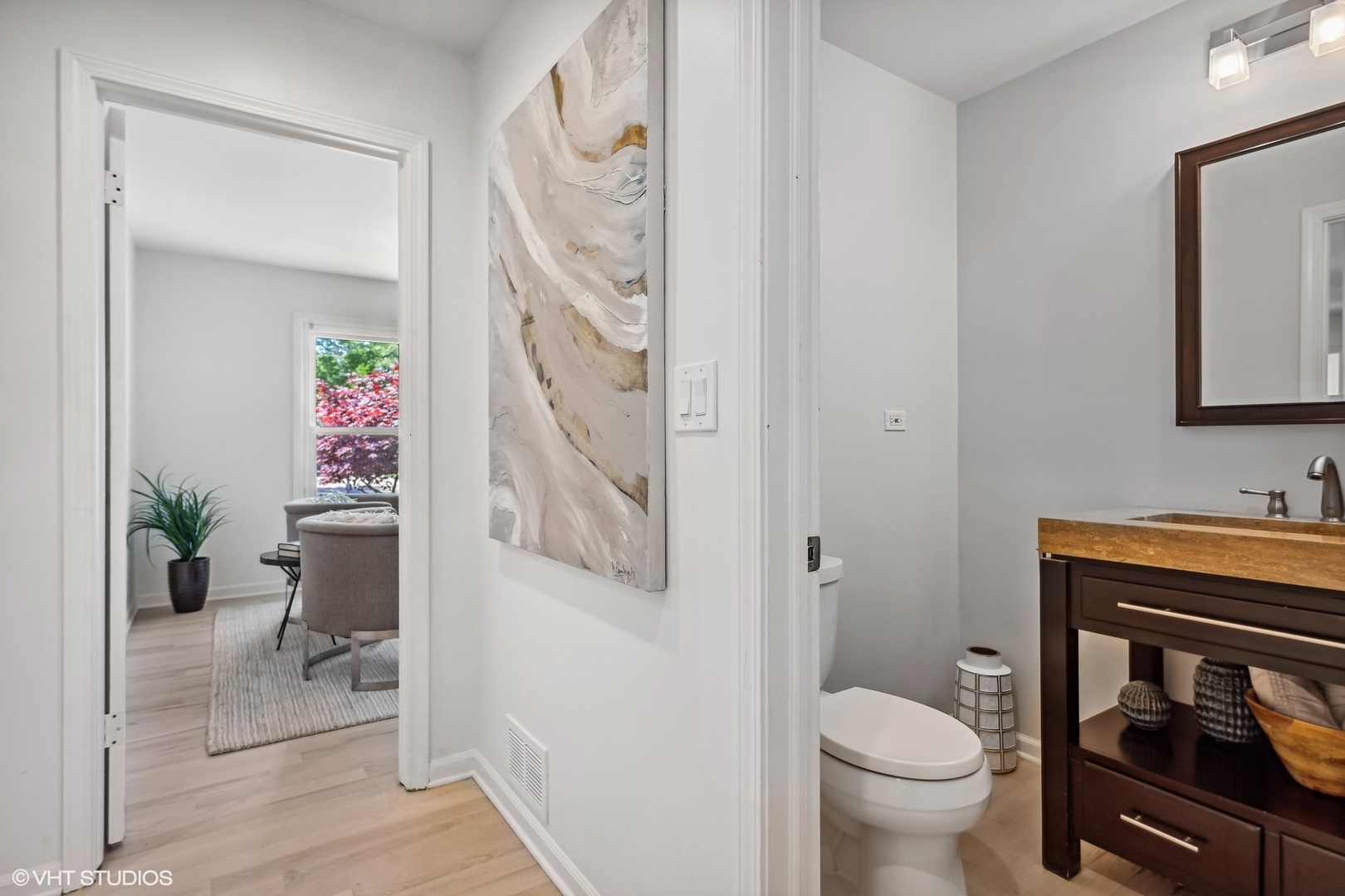 4130 Rutgers Lane Northbrook, IL 60062 - Photo 14 of 41 a bathroom with a toilet a sink and glass door