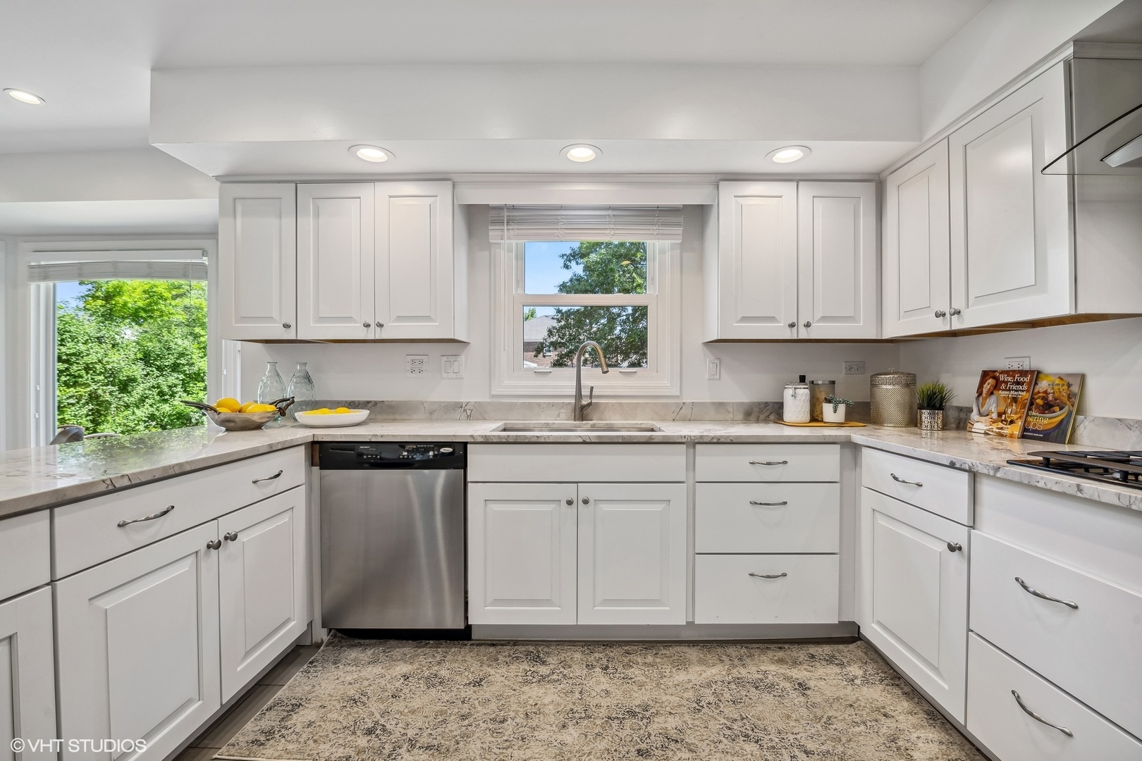 4130 Rutgers Lane Northbrook, IL 60062 - Photo 15 of 41 a kitchen with granite countertop white cabinets white appliances and sink
