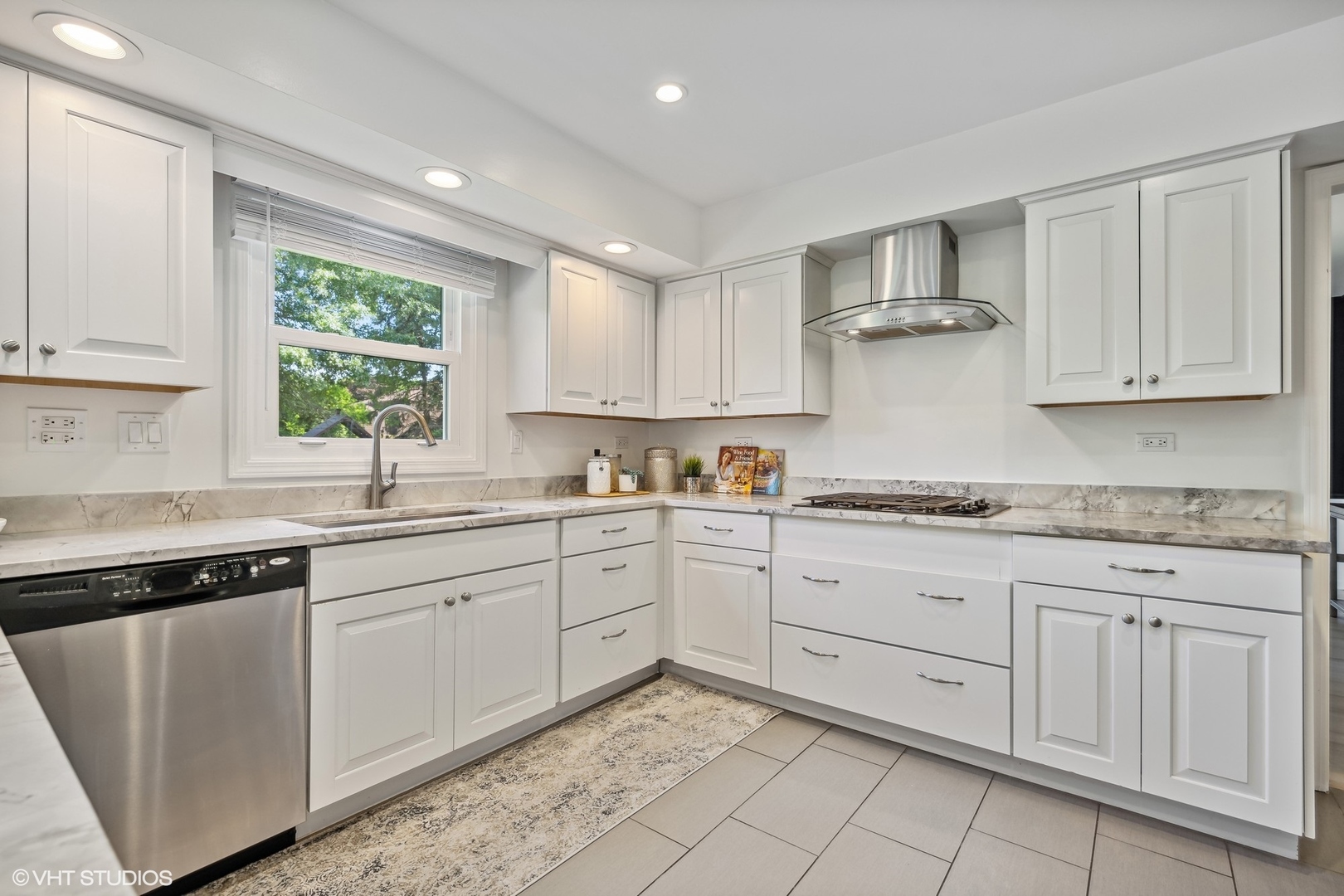 4130 Rutgers Lane Northbrook, IL 60062 - Photo 17 of 41 a kitchen with sink cabinets and window