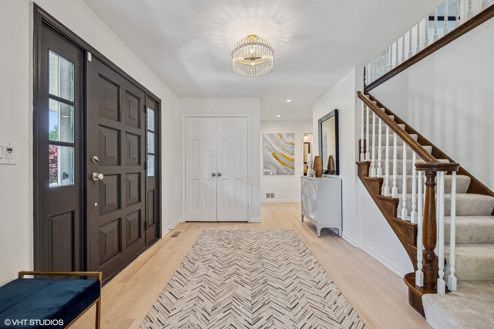 4130 Rutgers Lane Northbrook, IL 60062 - Photo 2 of 41 a bedroom with a bed and a chandelier