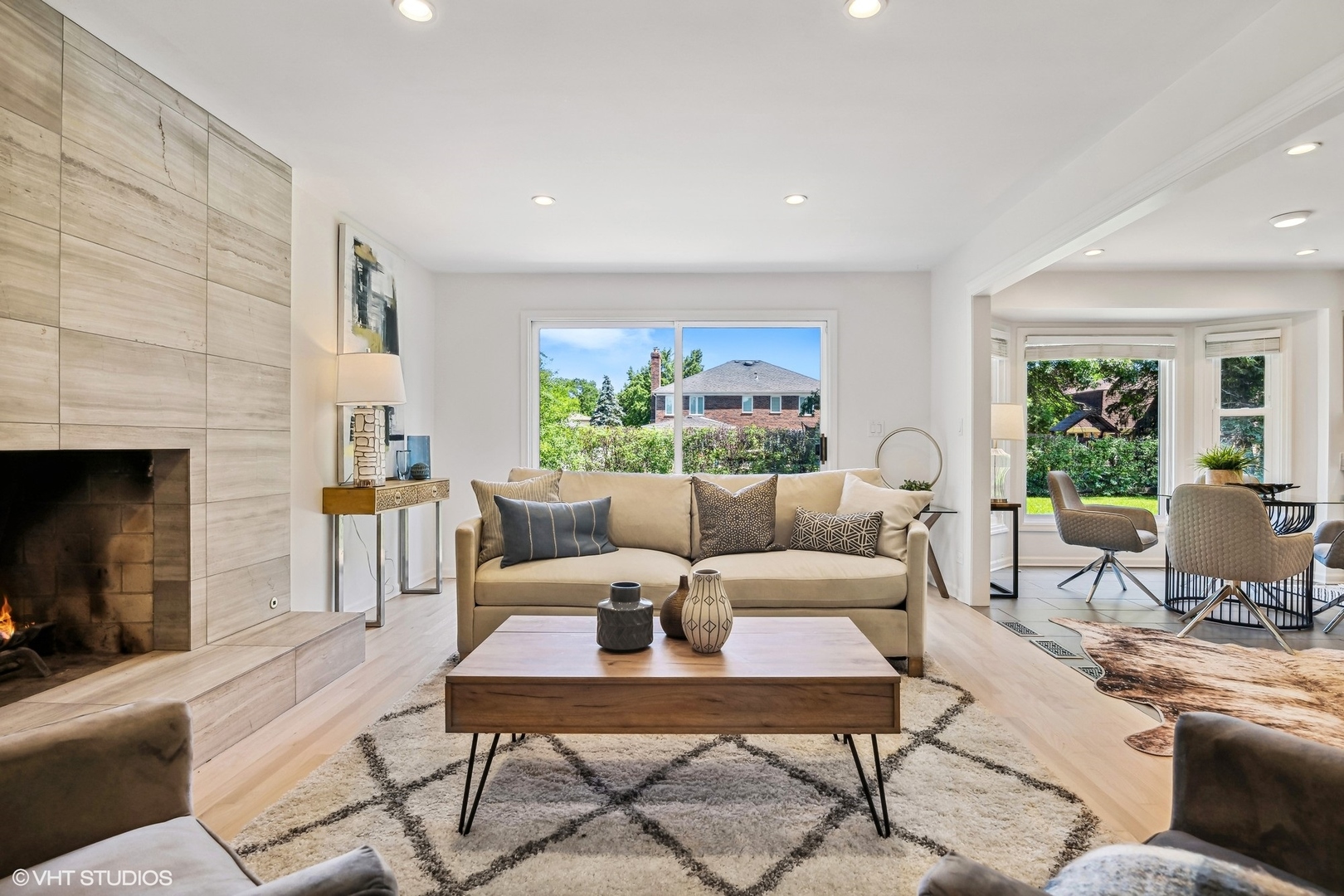 4130 Rutgers Lane Northbrook, IL 60062 - Photo 22 of 41 a living room with furniture a large window and a fireplace
